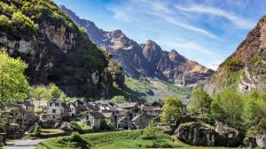 a village in a valley in the mountains at Rustico La Stalla di Adele in Cevio