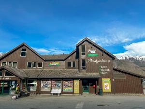 a store front of a building with mountains in the background at Vestly in Erve
