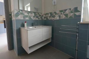 a bathroom with a sink and a mirror at Il Vecchio Pozzo Apartments in Ostigliano +79 photos