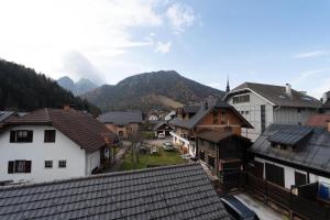 a view of a town with houses and mountains at CHALET MACESEN Apartment Mauro with sauna - in the center of Kranjska gora in Kranjska Gora
