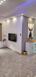 a room with a wall with a picture of a deer on the wall at 2 bedrooms apartment no 13 in Amman