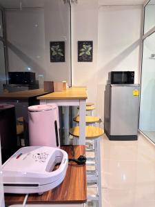 a kitchen with a white appliance sitting on a counter at Stay Together 3BR walkable to Nimman 6 Guests in Chiang Mai