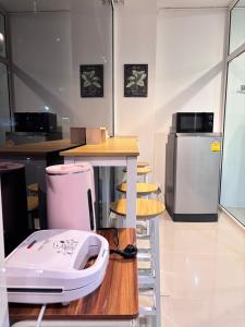 a kitchen with a white appliance sitting on a counter at Stay Together 3BR walkable to Nimman 6 Guests in Chiang Mai