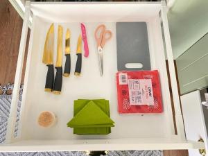 a wooden box with scissors and other kitchen utensils at Deluxe Suite in Vienna