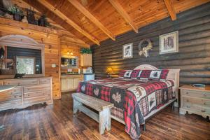 a bedroom with a bed and a sink in a cabin at Mountain View Cabins in Tellico Plains