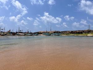 a group of boats sitting in the water at Letharo Residancies in Dodanduwa