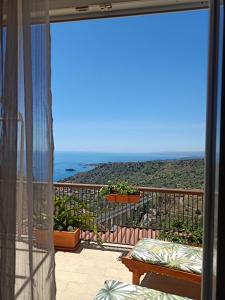 a balcony with a view of the ocean at Tao enJoy Suite in Taormina +36 photos