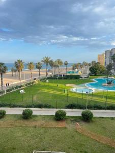 a park with a swimming pool and a beach at Urbanova apartamento in El Alted