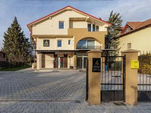 a building with a gate in front of it at Avenue Apartments Ilinden in Ilinden