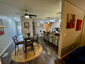 a dining room and kitchen with a table and chairs at Gated Lakefront Retreat in Edmond