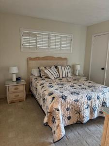 a bedroom with a large bed and a window at Ocean Dream in Kitty Hawk Beach +32 photos