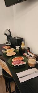 a table with plates of food on it at El Duende del Tejar in El Gastor