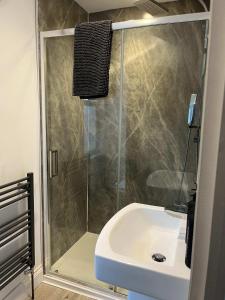 a bathroom with a shower and a sink at 1 Bed Room Flat Close to seafront in Weston-super-Mare