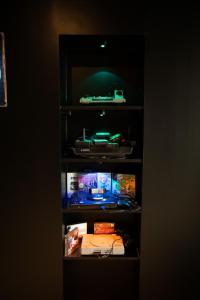a book shelf with a toy car on it at Arcade & Gaming Lodge in Trans-en-Provence