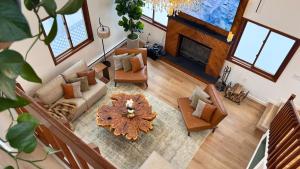 an overhead view of a living room with a fireplace at Blackwood Cabin Pocono in Pocono Farms East