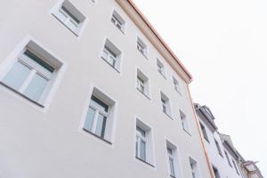 a white building with many windows at raum life - Design Apartment mit Küche in der Altstadt in Regensburg