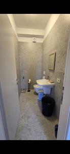 a bathroom with a sink and a tub and a toilet at Star Residence in Tirana +2 photos