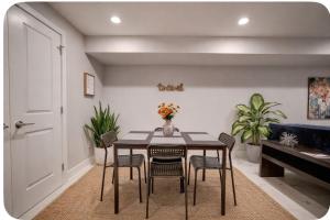 a dining room with a table and chairs at Artsy Hidden Gem ll -Free Parking -- in Philadelphia +2 photos