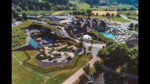 an aerial view of a resort with a pool at KOZJANSKA KOČA in Podčetrtek