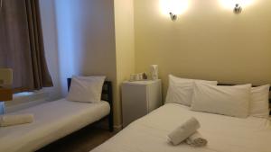 Postel nebo postele na pokoji v ubytování City View Hotel Stratford