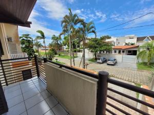 a balcony of a house with a view of a street at Lar no Atami com piscina aquecida in Pontal do Paraná