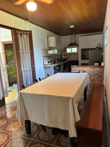 a kitchen with a large table in a room at MonSua in San Luis