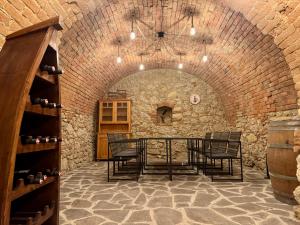 a dining room with a table in a brick wall at Erdeis Apartments in Krems an der Donau