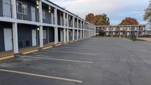 an empty parking lot in front of a building at Days Inn by Wyndham Champaign/Urbana in Champaign