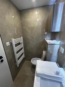 a small bathroom with a toilet and a sink at Studio 2 personnes maximum in Saint-Andiol