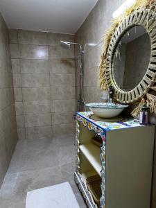 a bathroom with a sink and a mirror at Dar Laydam in Aït Zat +12 photos