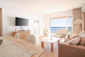 a living room with a couch and a table at Wohnung Rio in Calpe
