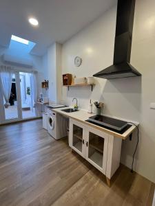 a kitchen with a sink and a stove at Casa La Culle in Favareta