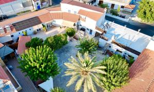 an overhead view of a courtyard with palm trees at The Courtyard Episkopi Guest Houses in Episkopi Limassol