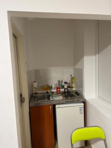 a small kitchen with a sink and a stove at Tim in Kalna +7 photos