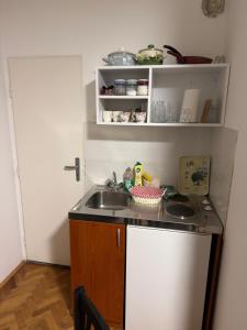 a small kitchen with a sink and a counter at Tim in Kalna