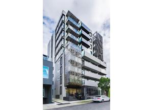 an architectural rendering of a building on a street at City Edge Box Hill Apartment Hotel in Box Hill