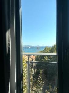 a view of the ocean from a window at Sevez Homes in Gelibolu