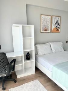 a bedroom with a bed and a desk and a chair at Sevez Homes in Gelibolu