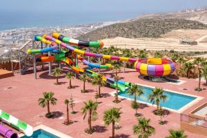an aerial view of a water park with a water slide at Luxury Seafront Apartment in Agadir Vue Mer Taghazout Surf & Ocean View your Home place in Agadir