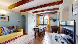 a living room with a couch and a table at house Al Cascinale in San Severino Marche +28 photos