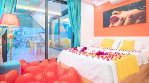 a bedroom with a bed with red hearts on it at Villa Adalya in Kaş +36 photos