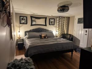 a bedroom with a bed with a stuffed animal on it at The Hillside Hottie! in Corydon