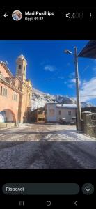 a view of a building with a clock tower at LOU CANTUN D'ENDON in Andonno +19 photos
