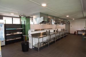 a kitchen filled with lots of kitchen equipment at Bunk Surfers Paradise in Gold Coast