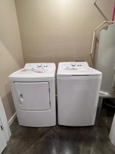 two washing machines sitting next to each other in a bathroom at Special Deal on Booking Unit 664 in Paris +5 photos