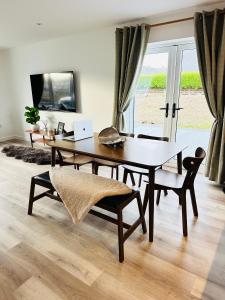 a desk with a laptop and a chair in a room at Perceval Road, Stornoway Town in Stornoway