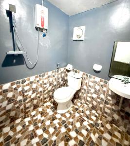 a bathroom with a toilet and a sink at Mount Avangan Eco Adventure Park in Coron +80 photos