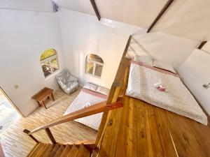 a room with two bunk beds and a wooden floor at Mount Avangan Eco Adventure Park in Coron