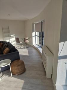 a living room with a couch and a table at Citywest 2 Bed Apartment in Citywest