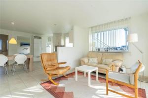 a living room with a couch and a table at 769-Hvide-Sande-Norregade-4-C in Hvide Sande